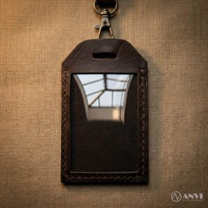 Handmade brown genuine leather ID badge holder with metal lanyard clip.